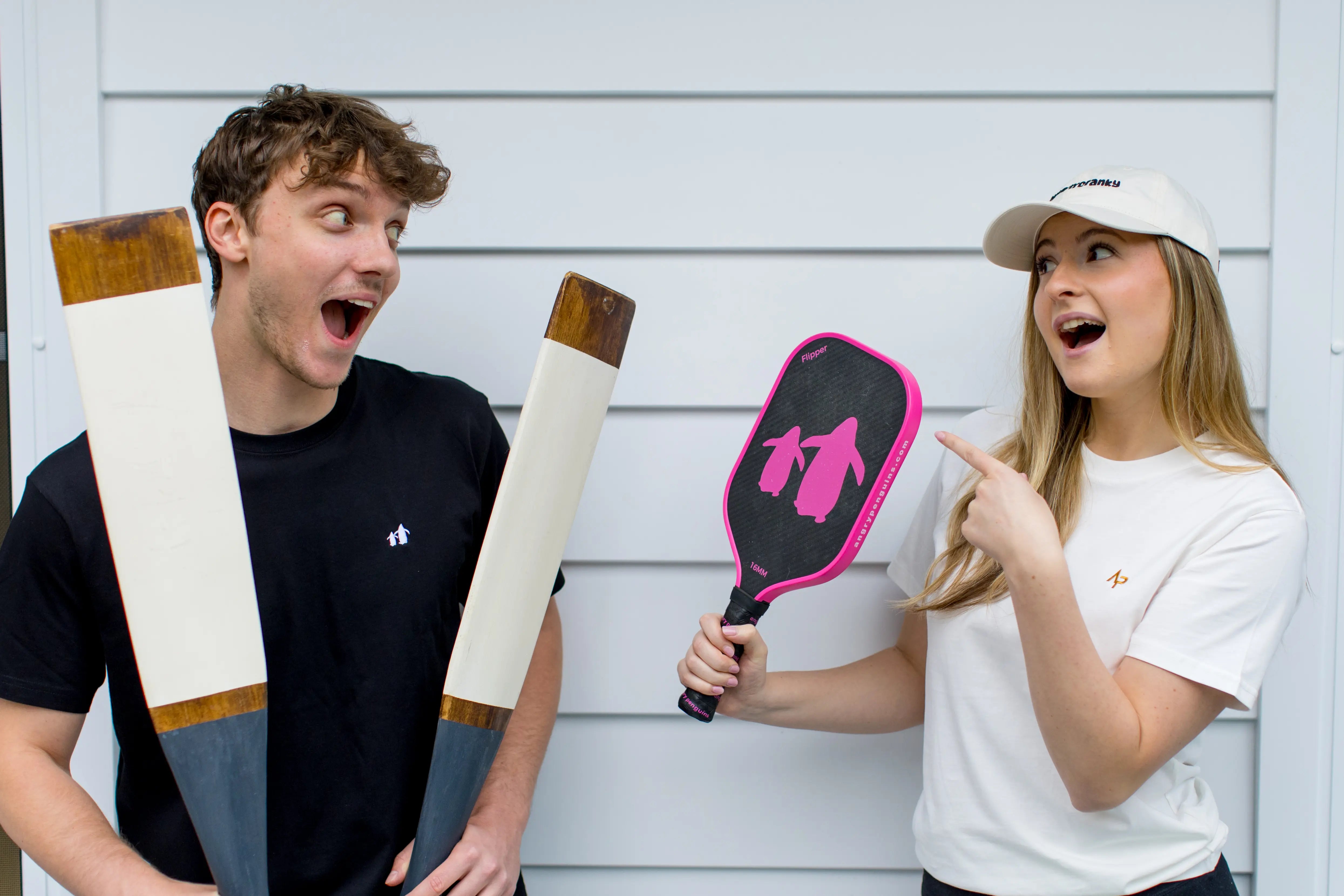 Angry Penguins Pickleball - Premium Paddles and Accessories - Lifestyle - Two people laughing